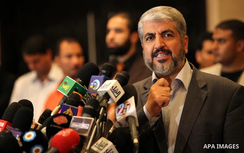 Exiled Palestinian Hamas leader Khaled Meshaal addresses a meeting with some 40 Palestinian prisoners who were freed by Israel but are to be deported overseas, in Cairo on October 18, 2011. Israeli soldier Gilad Shalit w...
