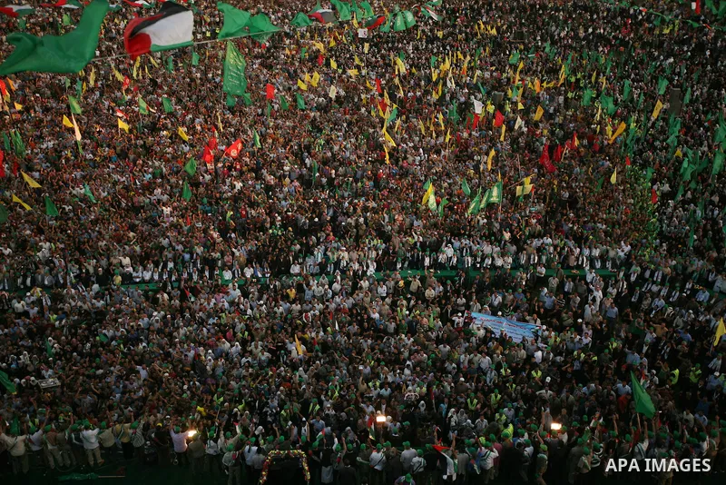 Thousands of Palestinians attend the welcome ceremony held for the Palestinian prisoners released from Israel in al-Katiba Yard in Gaza City, Oct. 18, 2011. Israel and the Palestinians finished on Tuesday the first phase...