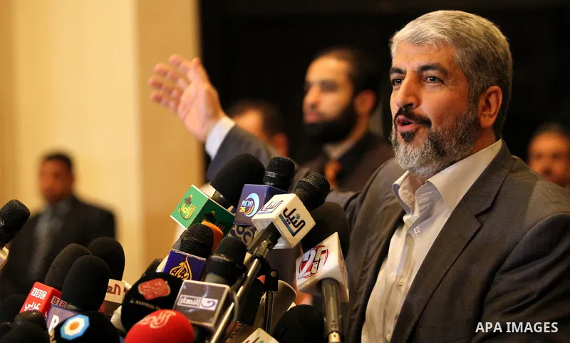 Exiled Palestinian Hamas leader Khaled Meshaal addresses a meeting with some 40 Palestinian prisoners who were freed by Israel but are to be deported overseas, in Cairo on October 18, 2011. Israeli soldier Gilad Shalit w...