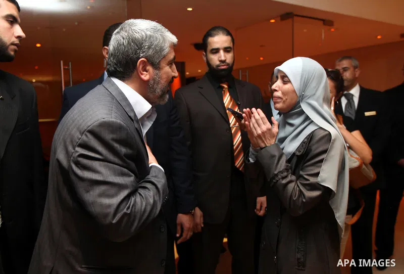 Exiled Palestinian Hamas leader Khaled Meshaal meets with some 40 Palestinian prisoners who were freed by Israel but are to be deported overseas, in Cairo on October 18, 2011. Israeli soldier Gilad Shalit was released in...