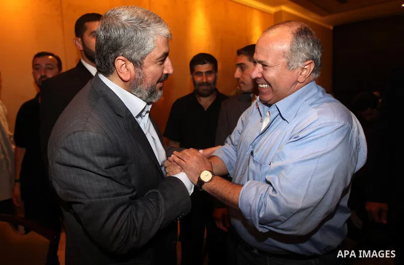 Exiled Palestinian Hamas leader Khaled Meshaal meets with an Egyptian Intellegence cheif, Rafat Shahada, in Cairo on October 18, 2011. Israeli soldier Gilad Shalit was released in a landmark deal which also saw 477 Pales...