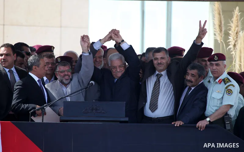 Palestinian president Mahmud Abbas welcomes hundreds of prisoners released from Israeli jails on Oct. 18, 2011 at the Palestinian Authority headquarters in the West Bank city of Ramallah. Hundreds of people gathered in R...