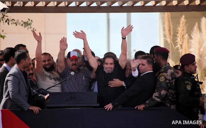 Palestinian prisoners are welcomed by a crowd following the release of hundreds of prisoners from Israeli jails on October 18,2011 at the Palestinian Authority headquarters in the West Bank city of Ramallah. Crowds of Pa...