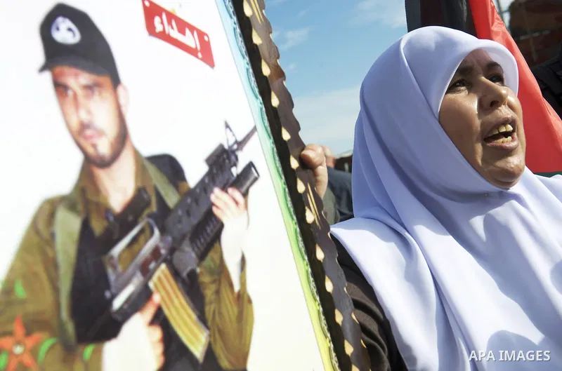 Palestinians celebrate the release of prisoners in Gaza Strip, Tuesday, Oct. 18, 2011. Hamas agreed to release Israeli soldier Galit Schalit in exchange for 1,027 Palestinian prisoners, many of them serving life sentence...