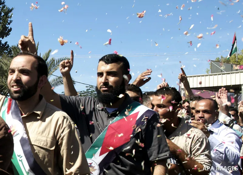 Palestinians celebrate the release of prisoners in Gaza Strip, Tuesday, Oct. 18, 2011. Hamas agreed to release Israeli soldier Galit Schalit in exchange for 1,027 Palestinian prisoners, many of them serving life sentence...