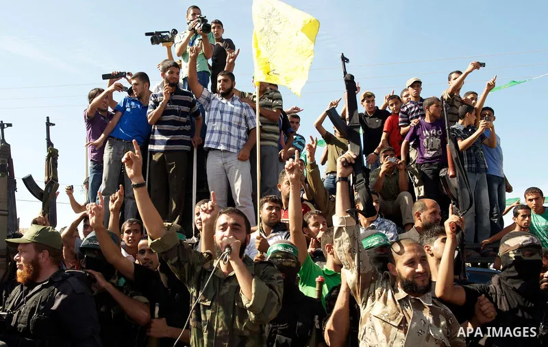 Palestinians celebrate the release of prisoners in Gaza Strip, Tuesday, Oct. 18, 2011. Hamas agreed to release Israeli soldier Galit Schalit in exchange for 1,027 Palestinian prisoners, many of them serving life sentence...