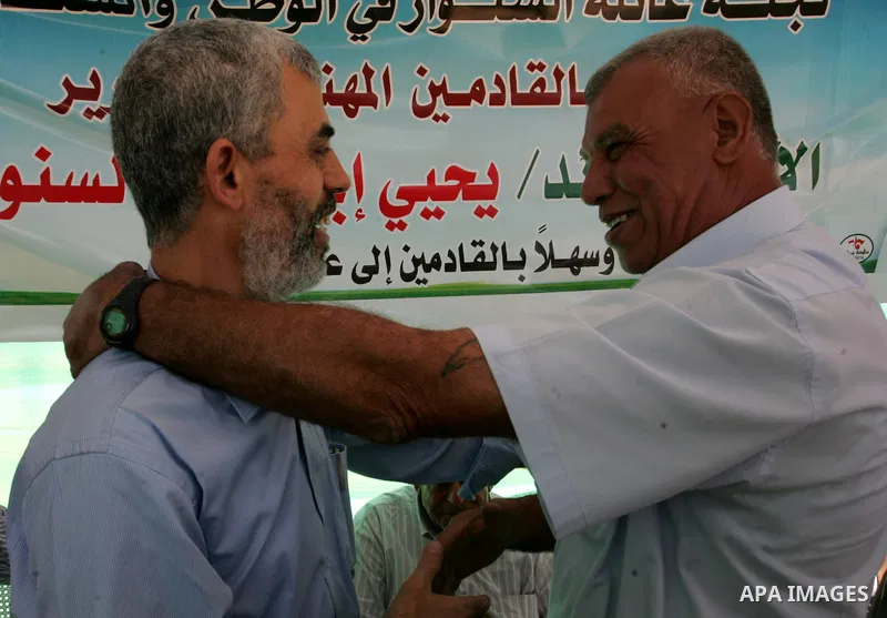 A Hamas freed Palestinian prisoner, Yehia Sinwar is greeted by relatives and friends at a tent near his house upon his return in the southern Gaza Strip town of Khan Yunis on October 19, 2011. Israeli soldier Gilad Shali...