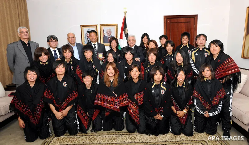 Palestinian President Mahmoud Abbas (Abu Mazen) meets with Japanese women's team in the West Bank city of Ramallah on Oct. 19, 2011. Photo by Mufeed Abu Hasnah