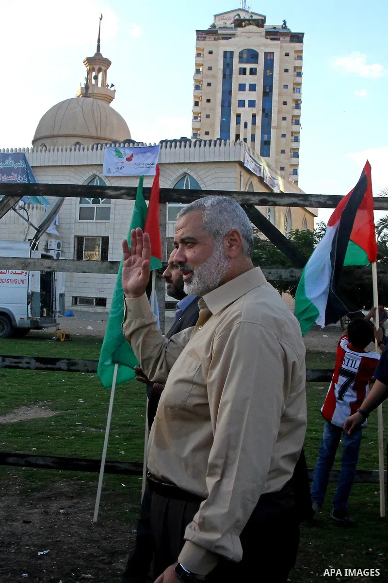 Palestinian prime minister in Gaza Strip, Ismail Haniya visits the tent erected to welcome Palestinian prisoners released in exchange for the captured Israeli soldier Gilad Schalit in Gaza City, Wednesday, Oct. 19, 2011....