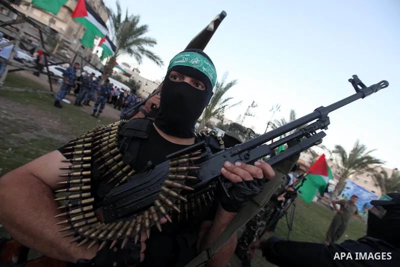 Palestinian Hamas militants stand guard outside the tent erected to welcome Palestinian prisoners released in exchange for the captured Israeli soldier Gilad Schalit in Gaza City, Wednesday, Oct. 19, 2011. Photo by Majdi...