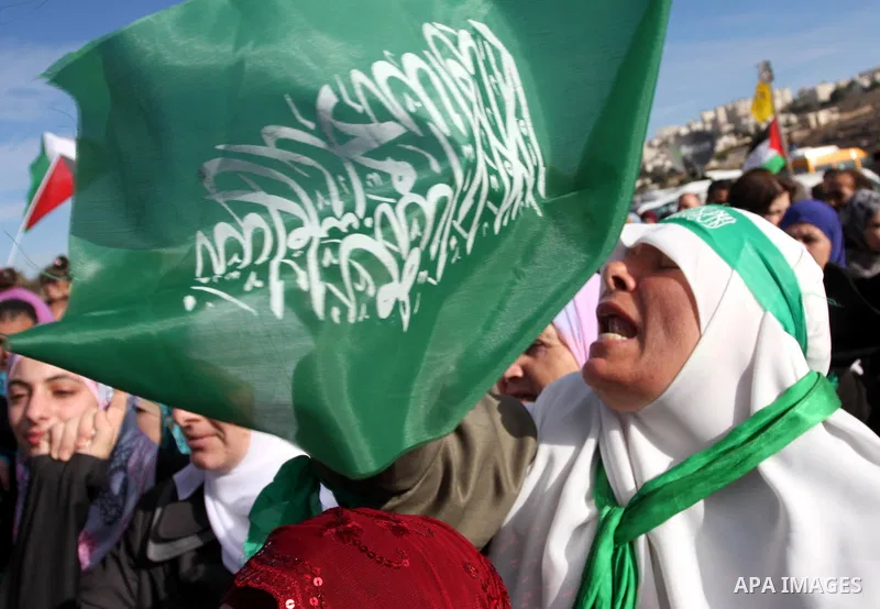 Palestinians wait at the Beituniya checkpoint for released Palestinian prisoners to cross into the West Bank city of Ramallah, Tuesday, Oct. 18, 2011. The Hamas militant group released an Israeli soldier Tuesday more tha...