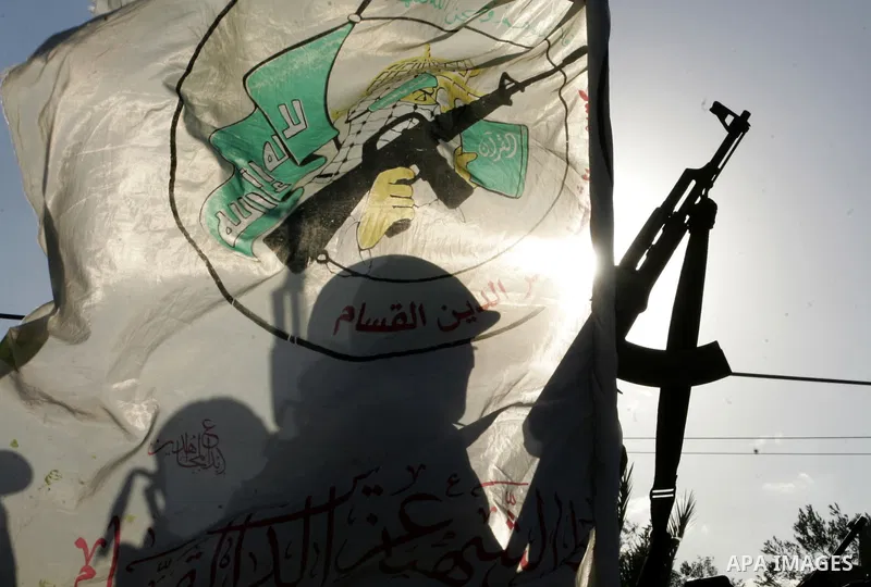 Hamas militants patrol during their visit to the freed Palestinian prisoners in Rafah in southern Gaza Strip October 19, 2011. Palestinians freed by Israel in a trade for soldier Gilad Shalit took their morning exercise...