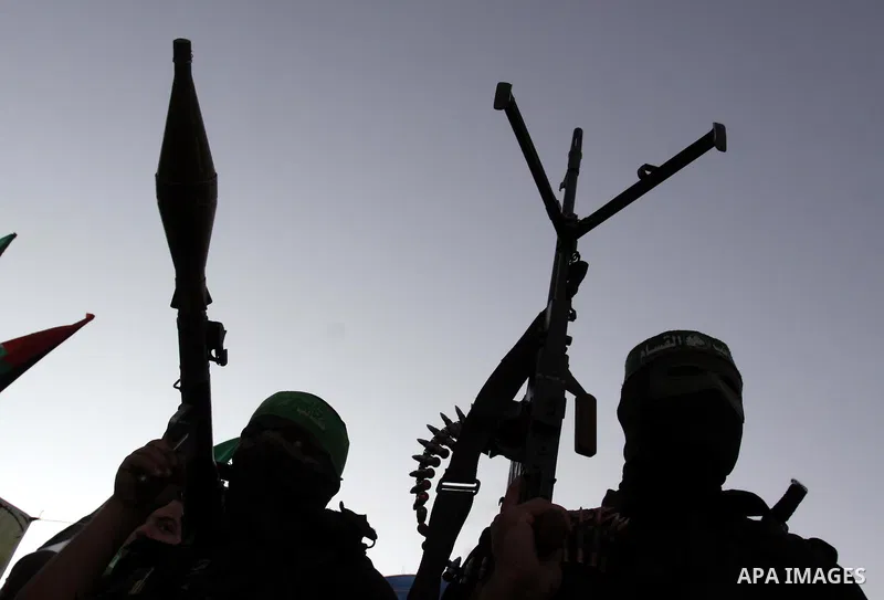 Palestinian Hamas militants stand guard outside the tent erected to welcome Palestinian prisoners released in exchange for the captured Israeli soldier Gilad Schalit in Gaza City, Wednesday, Oct. 19, 2011. Photo by Moham...