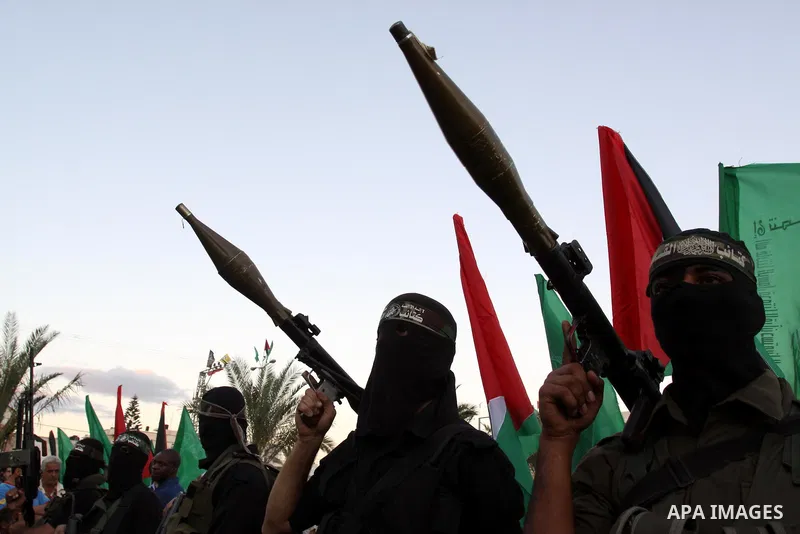 Palestinian Hamas militants stand guard outside the tent erected to welcome Palestinian prisoners released in exchange for the captured Israeli soldier Gilad Schalit in Gaza City, Wednesday, Oct. 19, 2011. Photo by Moham...
