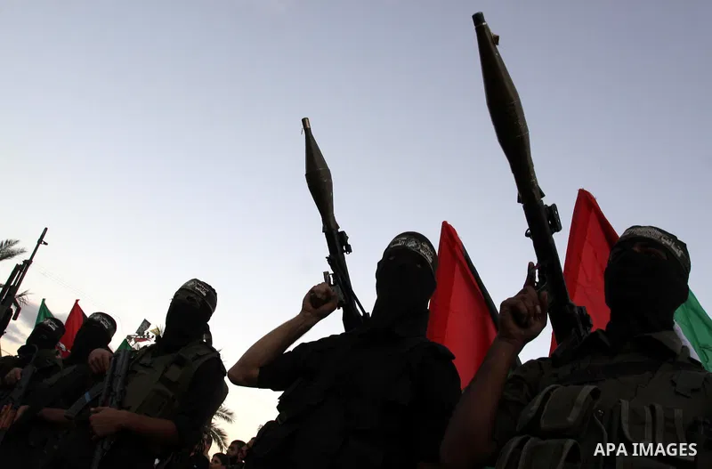 Palestinian Hamas militants stand guard outside the tent erected to welcome Palestinian prisoners released in exchange for the captured Israeli soldier Gilad Schalit in Gaza City, Wednesday, Oct. 19, 2011. Photo by Moham...