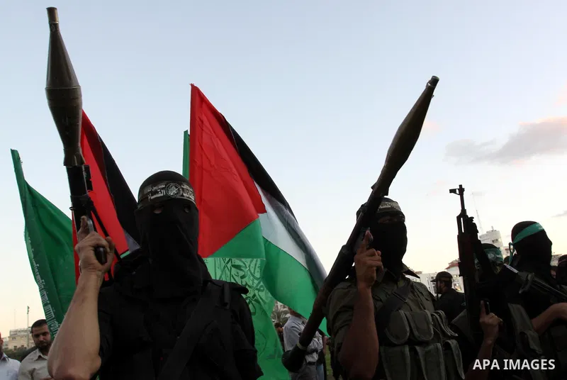 Palestinian Hamas militants stand guard outside the tent erected to welcome Palestinian prisoners released in exchange for the captured Israeli soldier Gilad Schalit in Gaza City, Wednesday, Oct. 19, 2011. Photo by Moham...