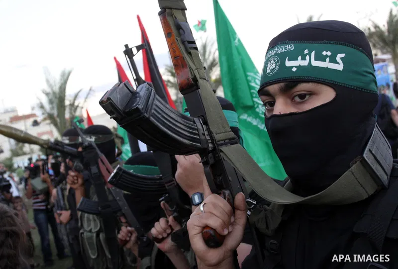 Palestinian Hamas militants stand guard outside the tent erected to welcome Palestinian prisoners released in exchange for the captured Israeli soldier Gilad Schalit in Gaza City, Wednesday, Oct. 19, 2011. Photo by Moham...