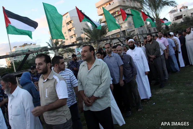 Palestinians shake hands as they visit the tent erected to welcome Palestinian prisoners released in exchange for the captured Israeli soldier Gilad Schalit in Gaza City, Wednesday, Oct. 19, 2011. Photo by Mohammed Asad