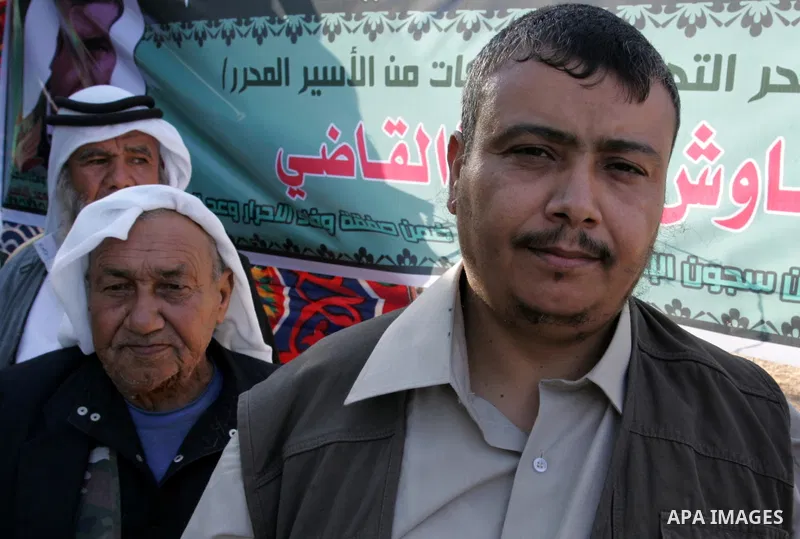 Hamas militants visit a freed Palestinian prisoner in Rafah in southern Gaza Strip October 19, 2011. Palestinians freed by Israel in a trade for soldier Gilad Shalit took their morning exercise on Wednesday around a luxu...