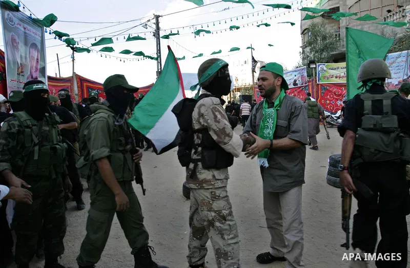 Hamas militants visit Khaled AL Moghiar a freed Palestinian prisoner in Rafah in southern Gaza Strip October 19, 2011. Palestinians freed by Israel in a trade for soldier Gilad Shalit took their morning exercise on Wedne...
