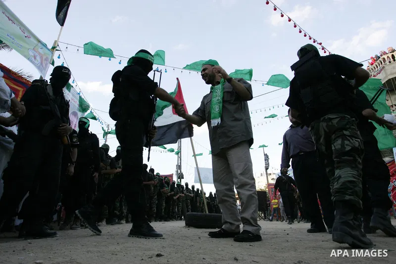 Hamas militants visit Khaled AL Moghiar a freed Palestinian prisoner in Rafah in southern Gaza Strip October 19, 2011. Palestinians freed by Israel in a trade for soldier Gilad Shalit took their morning exercise on Wedne...