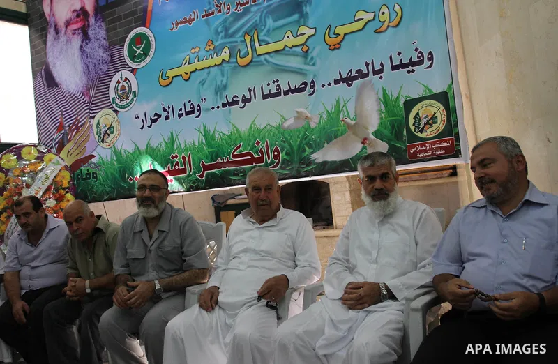 Freed Palestinian prisoner rawhi moshtaha is greeted by relatives and friends after his release from an Israeli jail in Gaza strip, on Oct. 20, 2011. who spent more than 23 years of isolation in a Gaza hide-out, for hund...
