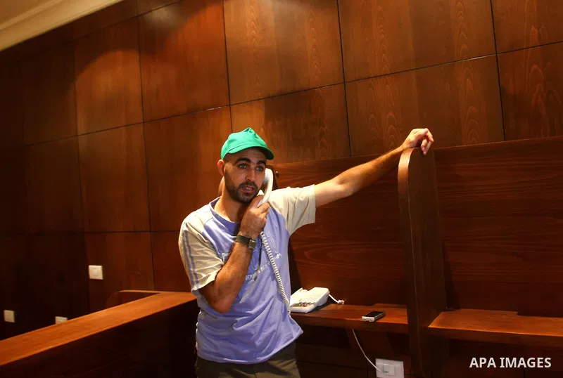 A freed Palestinian prisoner uses his phonel at Al-Mashtal hotel, where he and other former prisoners are currently staying, in the Gaza Strip Oct. 20, 2011. Israeli soldier Gilad Shalit and hundreds of Palestinians cros...
