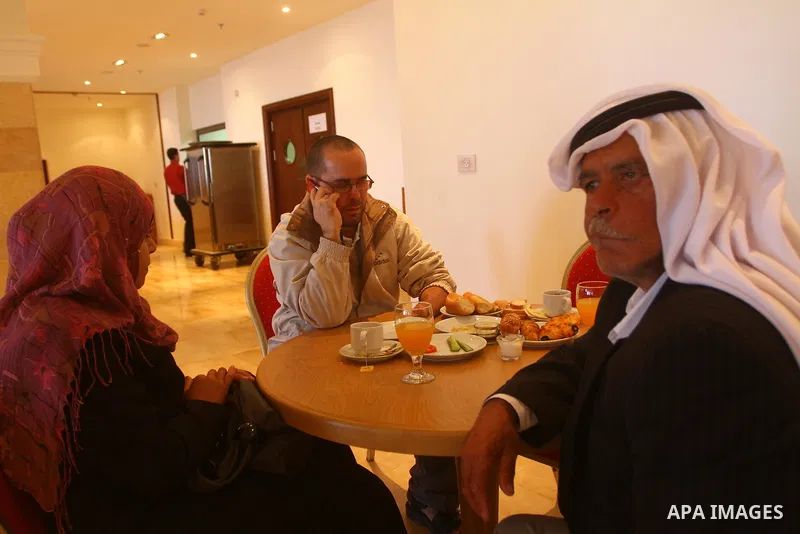 Freed Palestinian prisoners sit in the cafe of Al-Mashtal hotel, where they staying, in the Gaza Strip October 20, 2011. Israeli soldier Gilad Shalit and hundreds of Palestinians crossed Israel's borders in opposite dire...