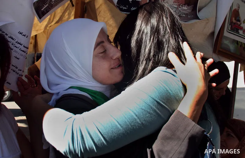 Palestinian Linan Abu Glma , prisoner who was released by the Israeli authorities on Tuesday receives well wishers in the West Bank city of Nablus Thursday , Oct. 20, 2011. Hundreds of Palestinian prisoners were released...