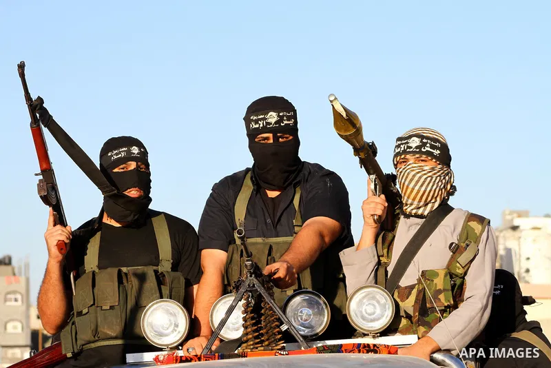 Army of Islam militants patrol during their visit to the freed Palestinian prisoners in Nusairat in central Gaza Strip October 20, 2011.The time is not right for meaningful Israeli-Palestinian peace talks, Palestinian Pr...