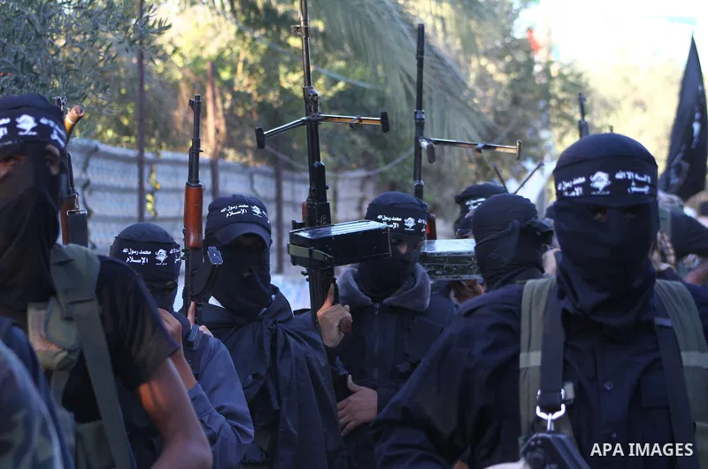 Army of Islam militants patrol during their visit to the freed Palestinian prisoners in Nusairat in central Gaza Strip October 20, 2011.The time is not right for meaningful Israeli-Palestinian peace talks, Palestinian Pr...