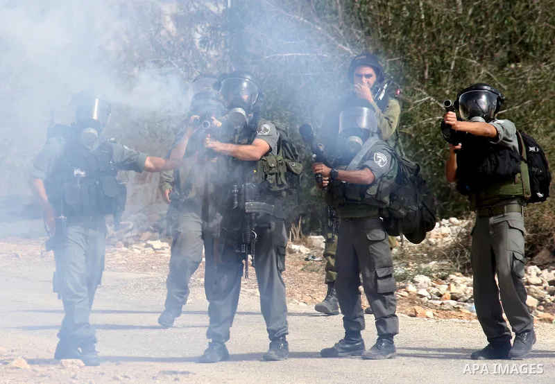 Israeli border police officers clash with Palestinian demonstrators as they demand access to their land near Kufr Qaddum, close to the northern West Bank Jewish settlement of Kdumim, Friday, Oct. 21, 2011. Photo by Wagdi...