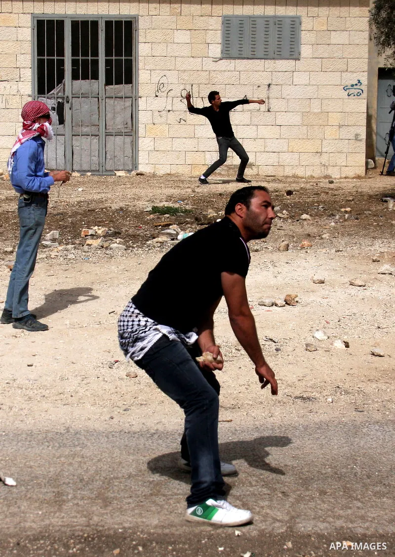Palestinian demonstrators clash with Israeli border police officers as they demand access to their land near Kufr Qaddum, close to the northern West Bank Jewish settlement of Kdumim, Friday, Oct. 21, 2011. Photo by Wagdi...