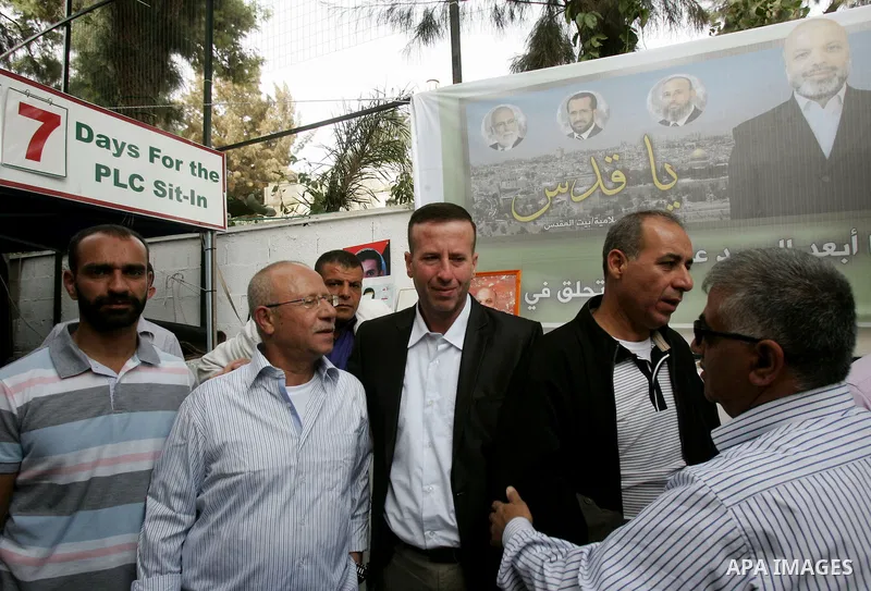 Freed Palestinian prisoners are greeted by others following their release from Israeli jails, at Red Cross headquarters in east Jerusalem on October 21, 2011. The Palestinian Hamas movement exchanged Gilad Shalit, the Is...