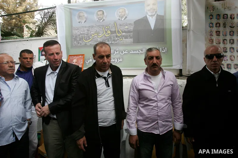 Freed Palestinian prisoners are greeted by others following their release from Israeli jails, at Red Cross headquarters in east Jerusalem on October 21, 2011. The Palestinian Hamas movement exchanged Gilad Shalit, the Is...