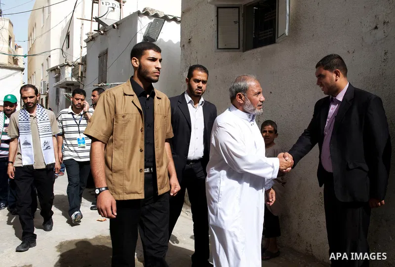 Palestinian Hamas leader Mahmoud al-Zahar is greeted after Friday prayers at a mosque in the Shati refugee camp, Gaza City October 21, 2011, where freed Palestinian prisoners and Hamas leader Ismail Haniya attend Friday...