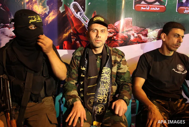 Freed Palestinian prisoners attend a celebration for the release of hundreds of prisoners following a swap with captured Israeli soldier Gilad Shalit on October 21, 2011 in Khan Yunis, southern Gaza Strip. Hamas rulers a...