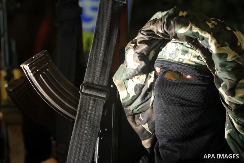 Palestinian militants of the Islamic group Hamas attend a celebration the release of hundreds of prisoners following a swap with captured Israeli soldier Gilad Shalit on October 21, 2011 in Gaza city. Hamas rulers are en...