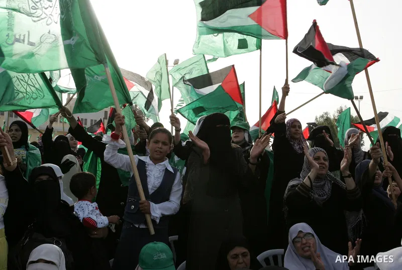 Palestinian supporters of the Islamic group Hamas celebrate the release of hundreds of prisoners following a swap with captured Israeli soldier Gilad Shalit on October 21, 2011 in Khan Yunis, southern Gaza Strip. Hamas r...