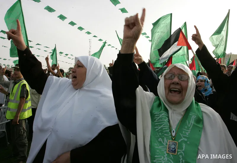 Palestinian supporters of the Islamic group Hamas celebrate the release of hundreds of prisoners following a swap with captured Israeli soldier Gilad Shalit on October 21, 2011 in Khan Yunis, southern Gaza Strip. Hamas r...