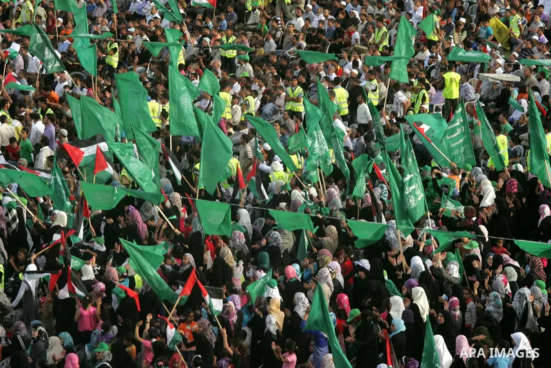 Palestinian supporters of the Islamic group Hamas celebrate the release of hundreds of prisoners following a swap with captured Israeli soldier Gilad Shalit on October 21, 2011 in Khan Yunis, southern Gaza Strip. Hamas r...