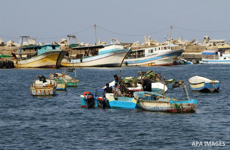 Palestinian fishermen work inside the port of Gaza City on Oct. 23, 2011. Fishermen, suffer from the tightening of the Israeli siege imposed on Palestinian fishermen a forbidden fishermen by Israel to enter the sea for m...