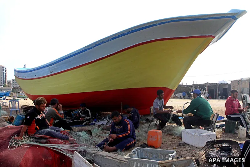 Palestinian fishermen work inside the port of Gaza City on Oct. 23, 2011. Fishermen, suffer from the tightening of the Israeli siege imposed on Palestinian fishermen a forbidden fishermen by Israel to enter the sea for m...