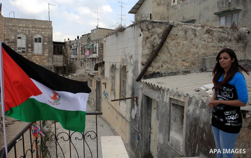 Freed Palestinian prisoner Palestinian Doaa Jayyousi stands at her house in the West Bank city of Tulkarem, Sunday, Oct. 23, 2011. Jayyousi, served almost 10 years of three life sentences she was given for her role in th...