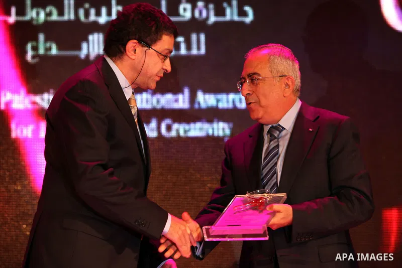 Palestinian Prime Minister Salam Fayyad Recognizes the Palestine International Award for Award and creativity of the Turkish Consul General representing the Turkish Prime Minister Recep Tayyip Erdogan in Nablus city, Oct...