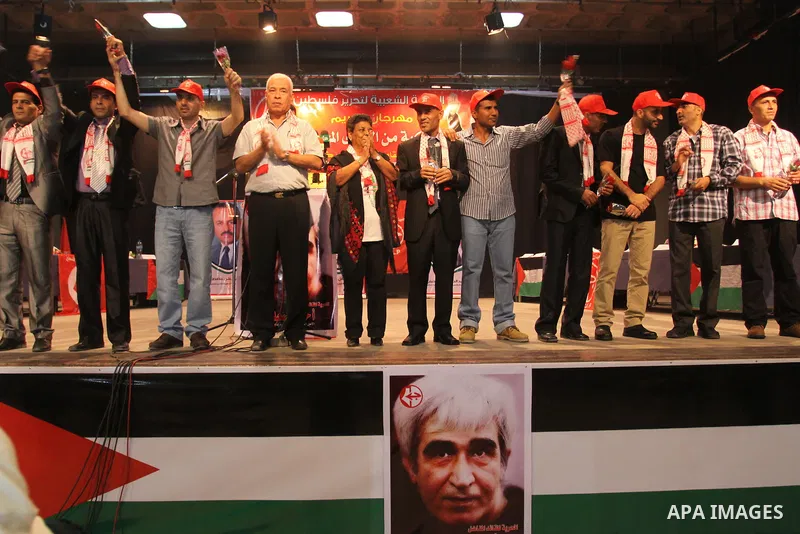 Freed Palestinian prisoners and their relatives attend a celebration organized by the Popular for Liberation Palestine in Gaza city on Oct. 26,2011. Prisoners released to the Gaza Strip in a dramatic swap for a captive I...
