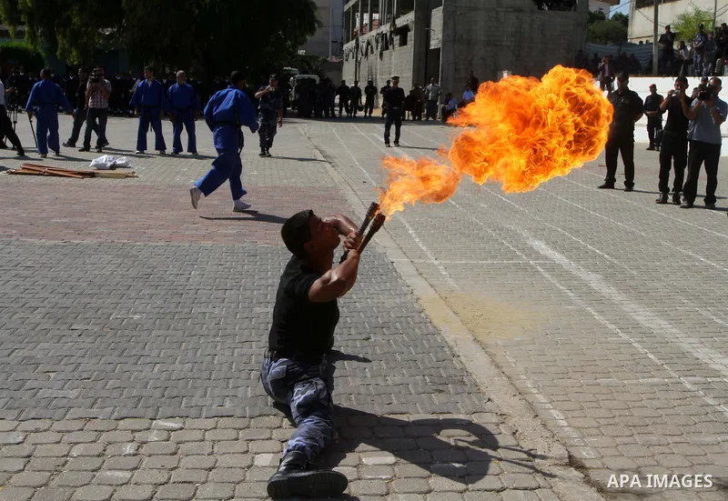 Hamas police officers demonstrate their skills during a ceremony in Gaza City in front of the media and Palestinian prisoners released in a recent swap between Hamas and Israel October 27, 2011. The Egyptian-brokered swa...