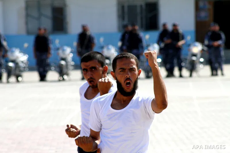 Hamas police officers demonstrate their skills during a ceremony in Gaza City in front of the media and Palestinian prisoners released in a recent swap between Hamas and Israel October 27, 2011. The Egyptian-brokered swa...