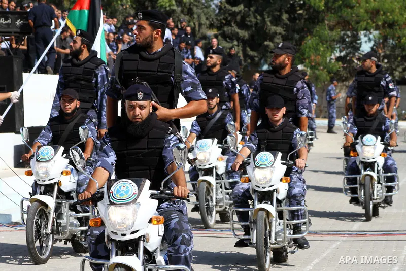 Hamas police officers demonstrate their skills during a ceremony in Gaza City in front of the media and Palestinian prisoners released in a recent swap between Hamas and Israel October 27, 2011. The Egyptian-brokered swa...