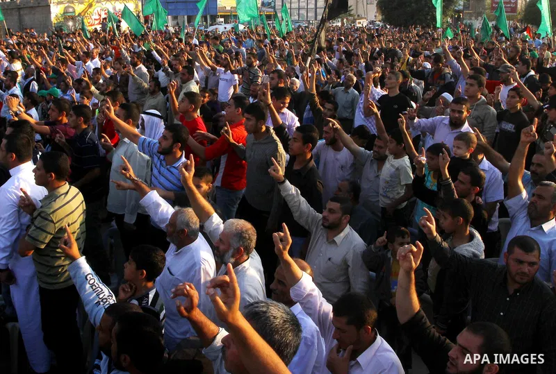 Palestinians take part in a celebration of the recent release of hundreds of Palestinians by Israel in the central Gaza Strip, Friday, Oct. 28, 2011. Hundreds of Palestinians were released in exchange for captured Israel...